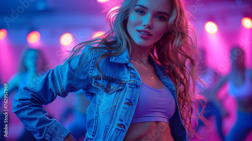 Girl dancing with a dancing group on a stage with blown color hair, denim jacket in neon color background    
