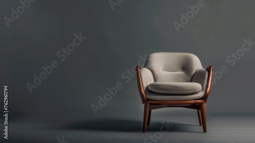 A stylish modern beige chair set against a grey backdrop. This piece of seating furniture exudes contemporary elegance. Radiating modern sophistication
