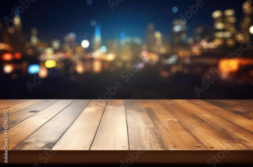 Empty wooden table top with blurred background of bar or cafe at night for product display montage  banner design.