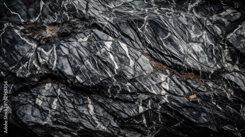 Abstract background of natural dark grey stone or rock monochromatics © BACKART