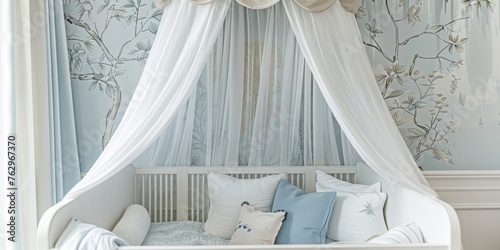 A white canopy bed with a blue and white wall behind it © xartproduction