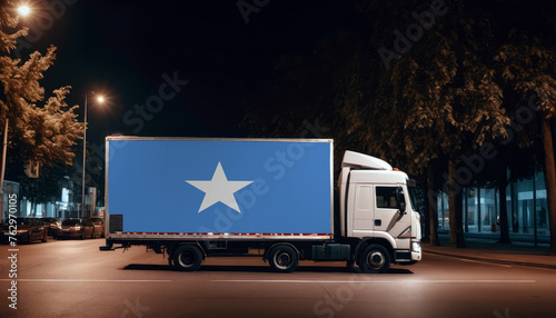 Somalia  flag on the back of white truck against the backdrop of the city. Truck  transport  freight transport. Freight and Logistics Concept