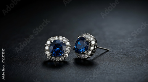 Close up diamond earrings with blue sapphire on dark background with copy space. Luxury female jewelry. generative.ai
