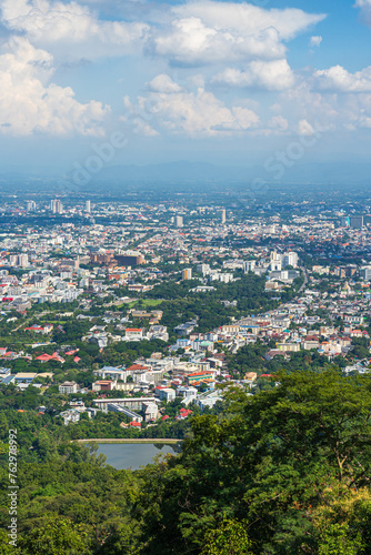 view in the mountains with road cityscape over the city building hotel, shopping mall,temple and houses air cloudy sky background with white cloud.