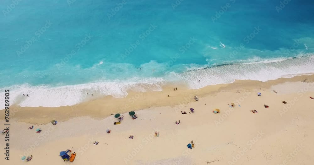Drone panning from the right to the left side of the frame above the beach of Myryos, a popular destination in the island of Kefalonia, Greece. Drone panning from the right to the left side of the frame above the beach of Myryos, a popular destination in the island of Kefalonia, Greece.