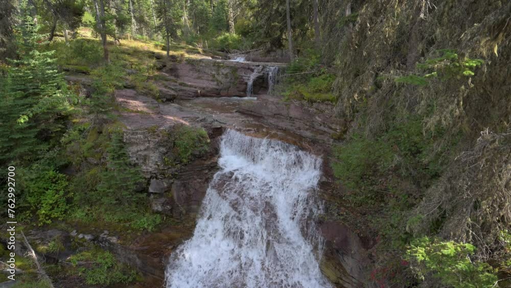 Virginia Creek Waterfall running into Virginia Creek in Glacier National Park, tilt up