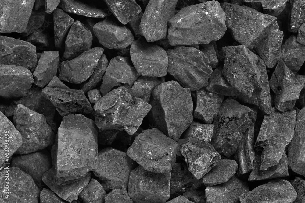 Coal. black crushed stone background texture close-up. rubble in a heap.