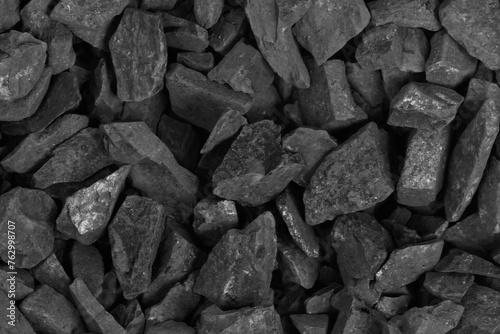 Coal. black crushed stone background texture close-up. rubble in a heap. photo