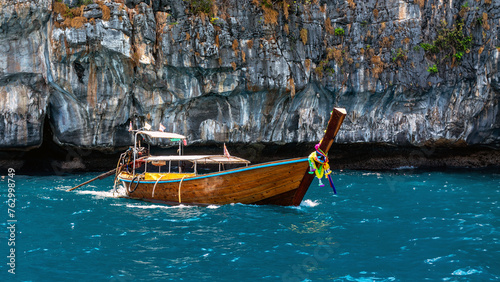A boat sailing on turquoise water. Phi Phi Island in Thailand.