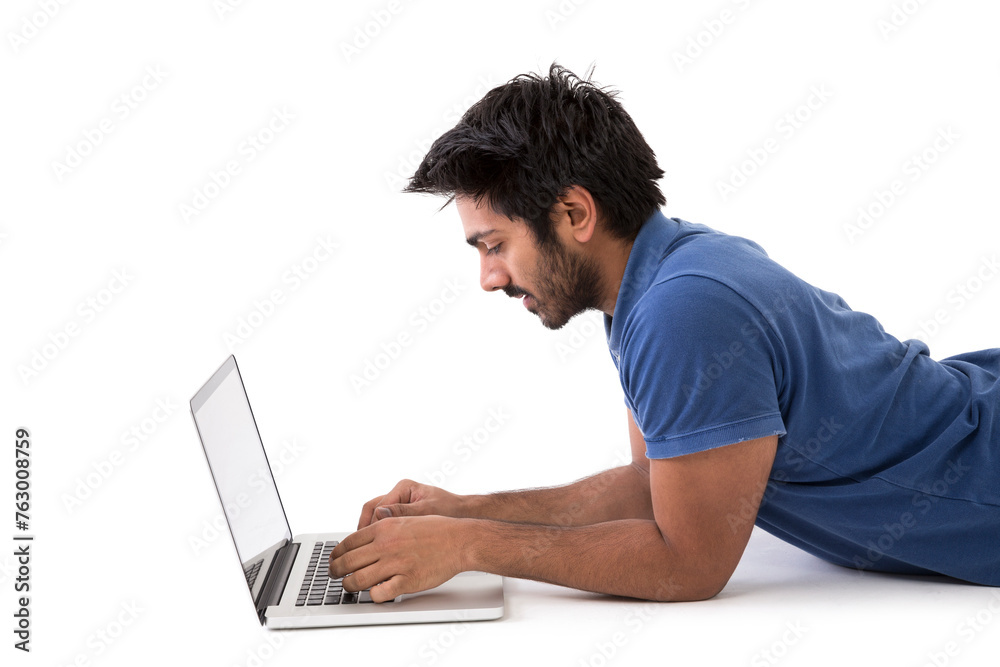 Happy Indian man using a laptop PC. Happy Indian man using a laptop PC.