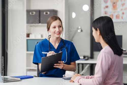 Depression Asian female patient talking with psychiatrist in doctor office Let's talk about the results of the health examination at the clinic.