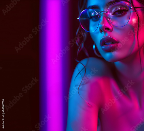 Fashion Surreal Concept. Stunning tousled hair girl of neon glow lighting  shimmer makeup wearing glasses. illuminated with dynamic composition and dramatic lighting. copy text space  