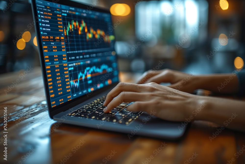 Businessman's hand holding a tablet, stock market background Businessman's hand holding a tablet, stock market background