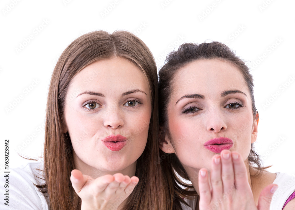 Two beautiful women blowing a kiss at you. Two beautiful women blowing a kiss at you.