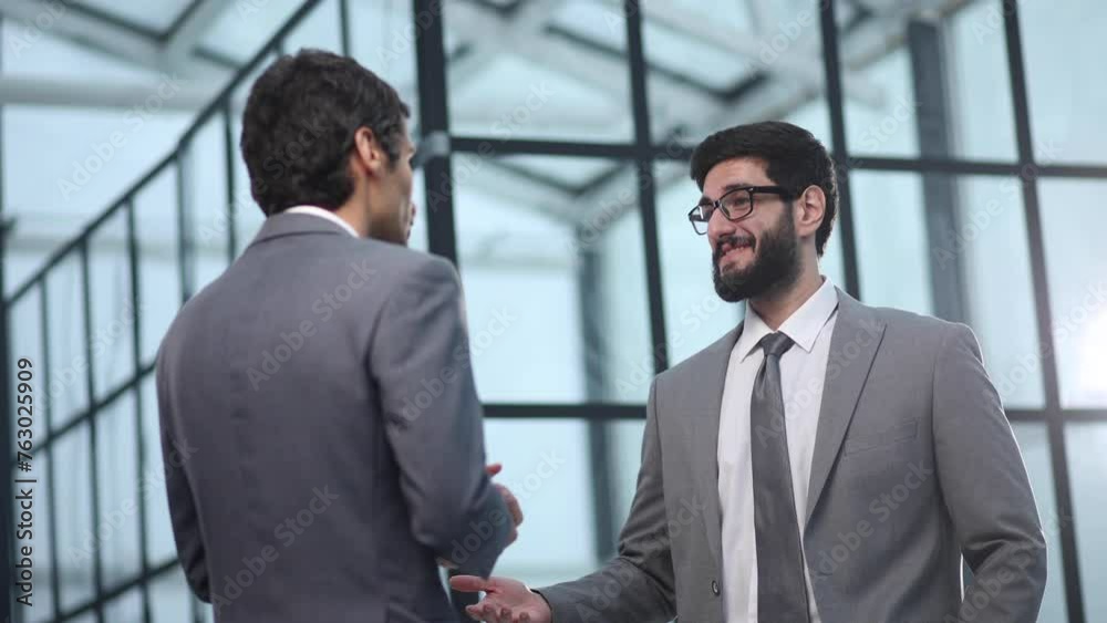 Business people shaking hands, finishing up a meeting Business people shaking hands, finishing up a meeting