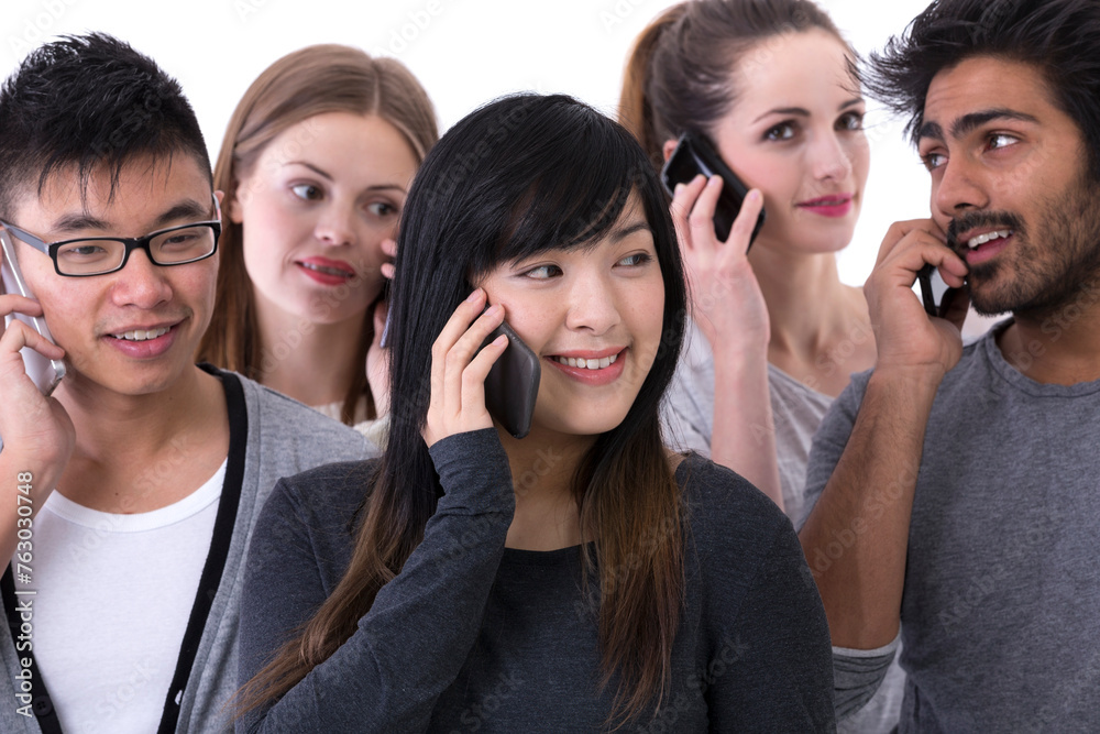 Happy group of friends talking on there Smartphone's. Happy group of friends talking on there Smartphone's.