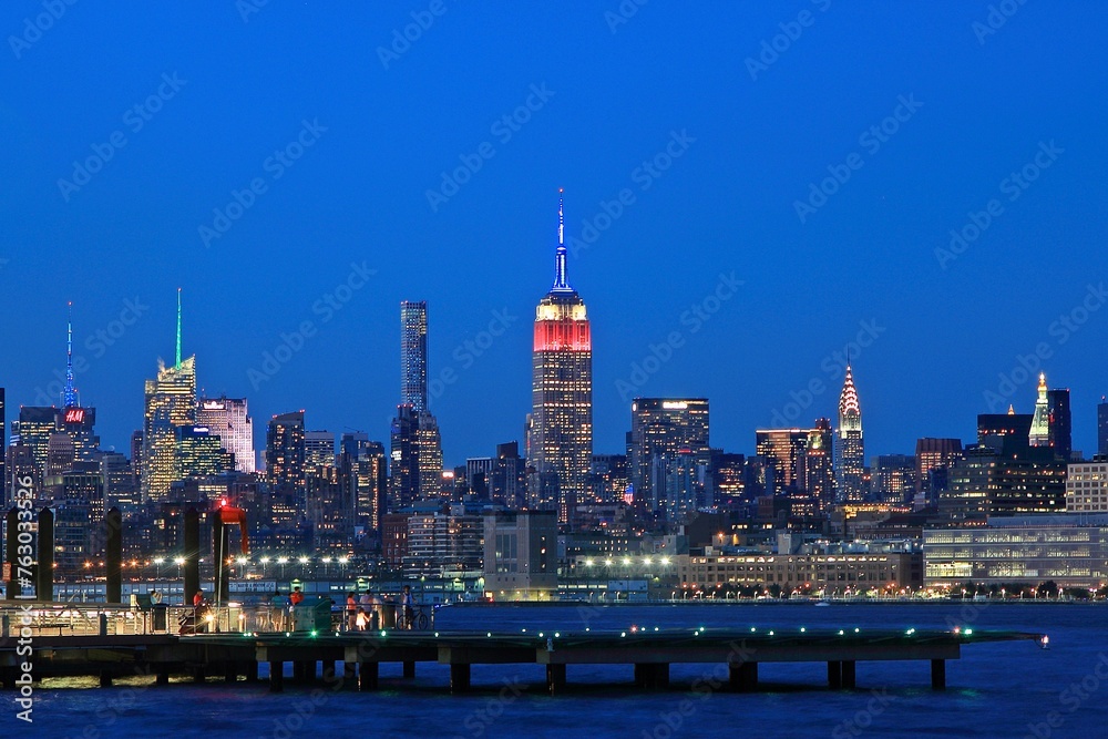 Manhattan Skyline in evening. Sunset colors are still reflected off buildings.