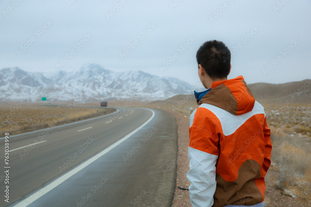 Hainan Mongolian and Tibetan Autonomous Prefecture, Qinghai Province - young people standing on the road Hainan Mongolian and Tibetan Autonomous Prefecture, Qinghai Province - young people standing on the road