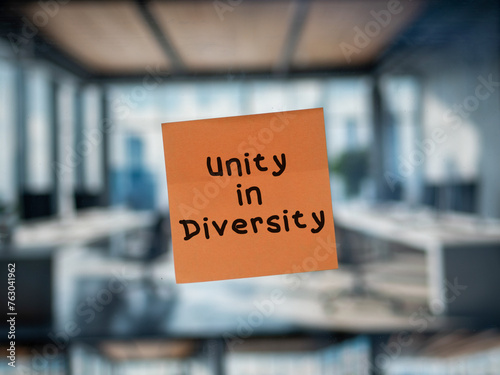 Post note on glass with \'Unity in Diversity\'.