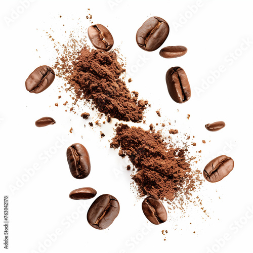 Close-up of roasted brown coffee beans, some whole and some cracked, spilling out of a white cup photo