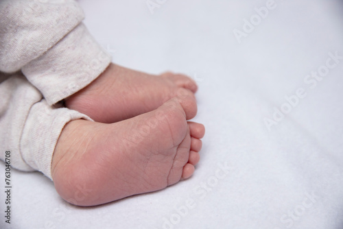 Newborn baby holds mother's hand. selective focus