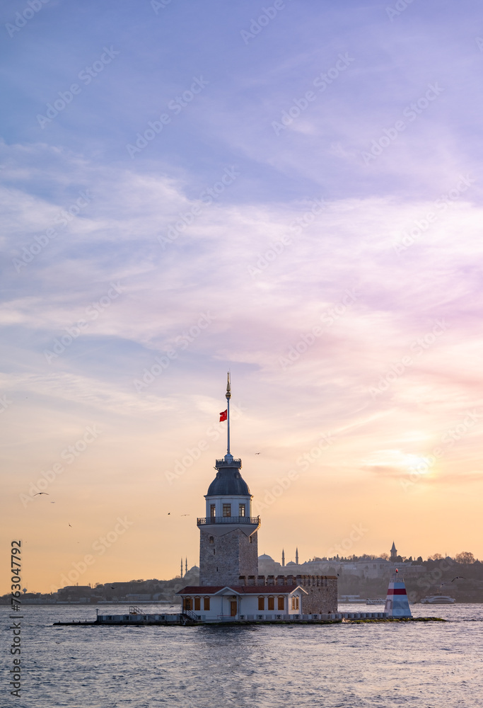 Beautiful sunset over Bosphorus with famous Maiden's Tower (Kiz Kulesi) also known as Leander's Tower, symbol of Istanbul, Turkey. Scenic travel background for wallpaper or guide book
