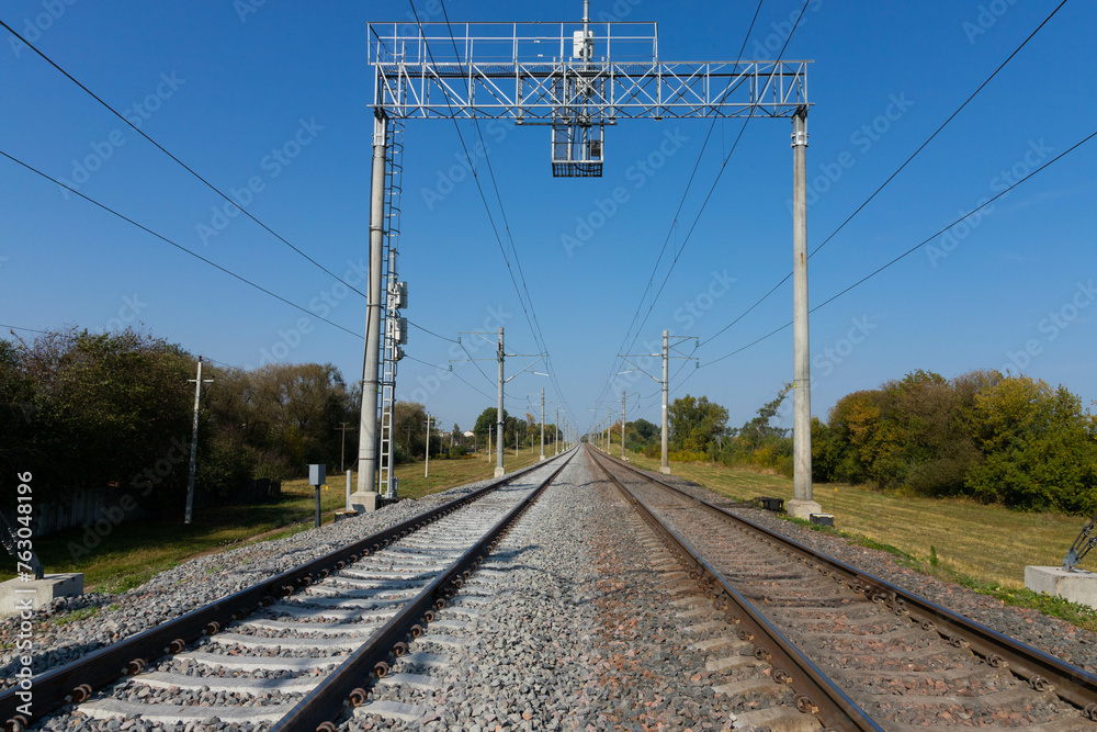 Railway with electric wires going into the distance. Logistics concept.