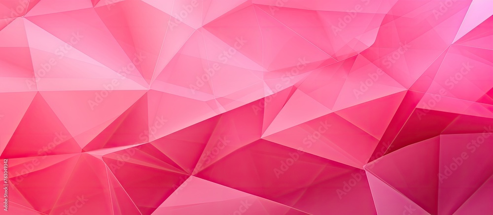 Fototapeta premium A detailed closeup of a pink geometric background showcasing various triangles creating a symmetrical pattern. The shades of magenta and pink resemble petals on an automotive wheel system