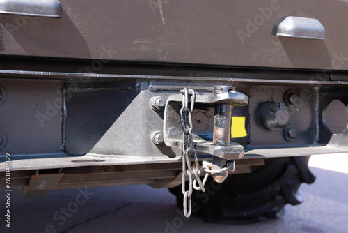 Black hairpin, hook for closing a semi-trailer close-up. Truck parts concept. Selective focus photo