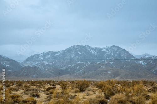 Hainan Mongolian and Tibetan Autonomous Prefecture, Qinghai Province-Grasslands and roads under the snow-capped mountains