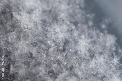 close-up macrophotography of crystals of geometric patterns of snowflakes © Alex