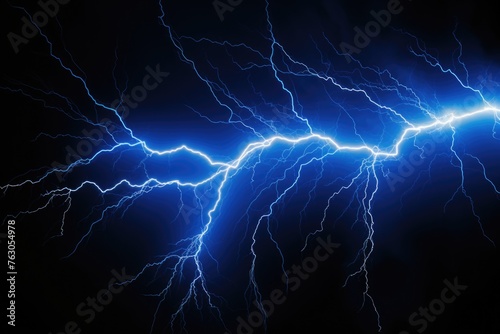 A striking blue lightning bolt in a dark stormy sky. Perfect for weather-related designs photo