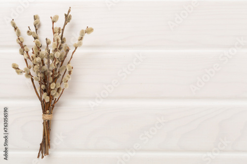 Pussy willow branches on woooden background, top, view. Palm Sunday concept