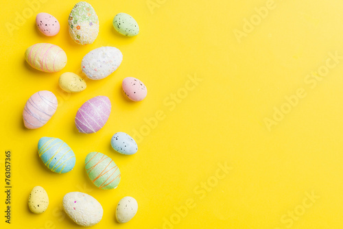 Happy Easter concept. Preparation for holiday. Easter eggs on colored background. flat lay top view copy space banner