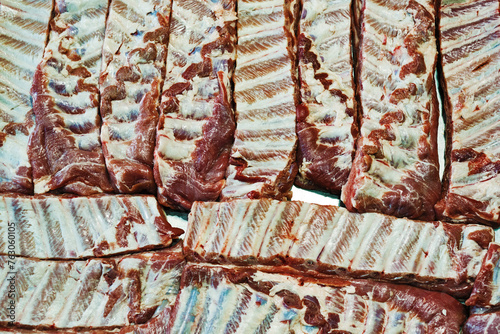 closeup view of raw marinated ribs ready for cooking