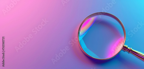 A vibrant blue and pink gradient behind a clear magnifying glass. photo