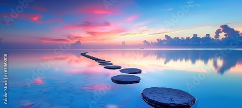 Tranquil zen stones in the water mirror the graceful dance of sunlight reflections at sunset
