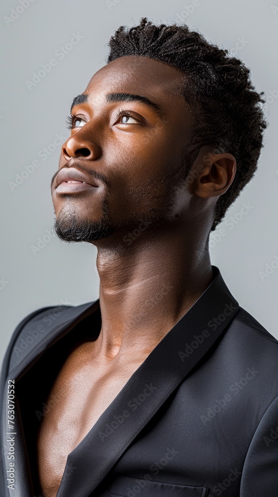 A young African dancer turned business owner, in a suit that moves as gracefully as he does, entrepreneurship with rhythm A young African dancer turned business owner, in a suit that moves as gracefully as he does, entrepreneurship with rhythm