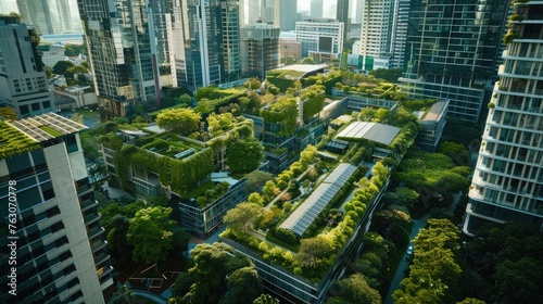 Aerial view of a green-roofed urban landscape nestled among high-rise buildings