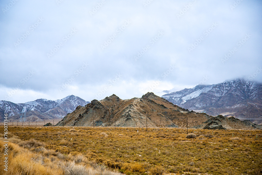 Hainan Mongolian and Tibetan Autonomous Prefecture, Qinghai Province-Grasslands and roads under the snow-capped mountains Hainan Mongolian and Tibetan Autonomous Prefecture, Qinghai Province-Grasslands and roads under the snow-capped mountains