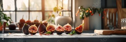 Ripe figs on a kitchen counter, backlit by a window. photo