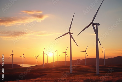 Wind turbines at sunset, aerial view. Renewable energy, ecology, environment concept