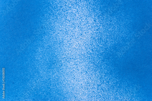 スプレー塗料で塗られた青色の背景 
