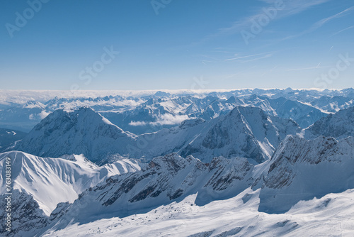 snow covered mountains in the Alps in winter in Austria with blue sky in March 