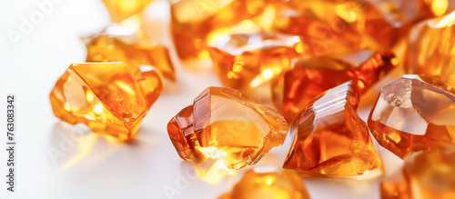 Wallpaper Mural A pile of orange gemstones on a white surface, amber Torontodigital.ca