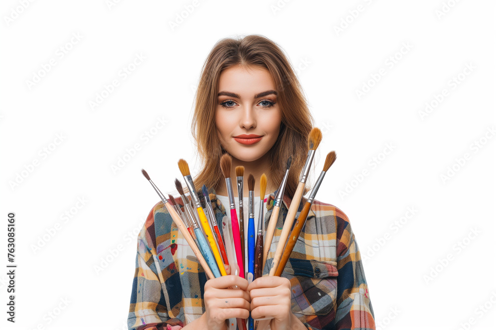 young woman shows many watercolor paintbrushes and paint palettes in her hands isolated on a white background, facing to the camera, A beautiful young caucasian woman shows paintbrushes with her hands young woman shows many watercolor paintbrushes and paint palettes in her hands isolated on a white background, facing to the camera, A beautiful young caucasian woman shows paintbrushes with her hands