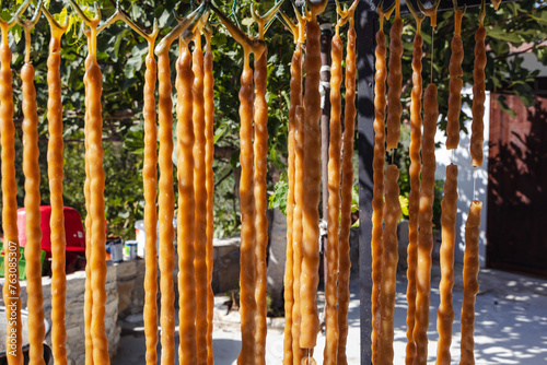 Soutzoukos or shoushoukos sweets in garden of Sofia And Andreas House in Letymbou village, Cyprus photo