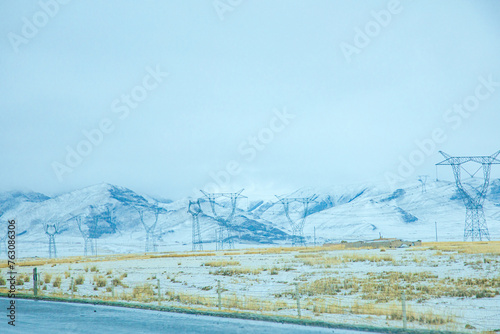 ainan Mongolian and Tibetan Autonomous Prefecture, Qinghai Province - Electric power facilities under the snowy mountains