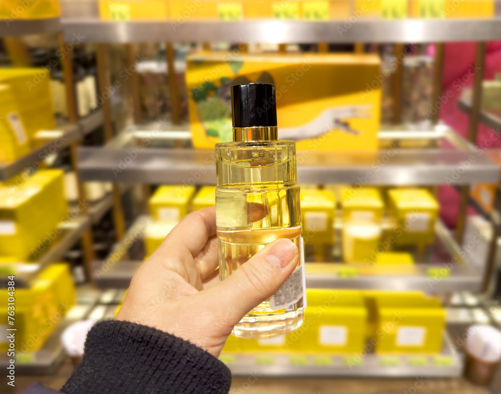 buying make up at cosmetics section in store. choosing cosmetics, perfumes, creams and shampoos buying make up at cosmetics section in store. choosing cosmetics, perfumes, creams and shampoos