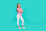 Full body photo of nice teen woman folded hands confident pose wear trendy print pink clothes isolated on cyan color background
